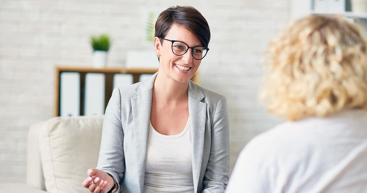 Professional woman with client